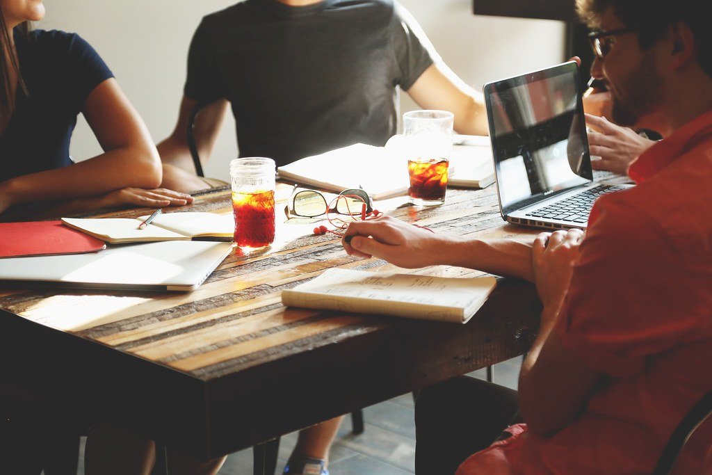 Team members collaborating around a table